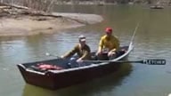 Rowing Jon boat in river