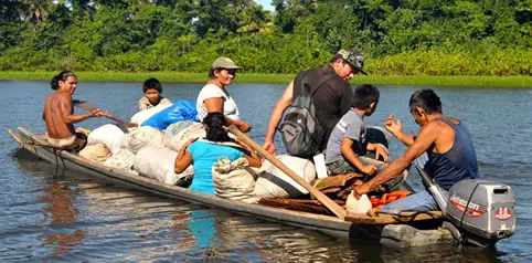 small overloaded flat bottom boat