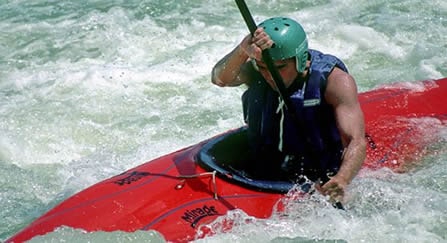 Kayak with large rocker in rough water