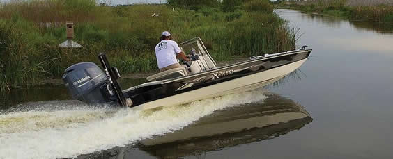 shallow draft boat in shallow water