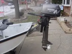 outboard motor mounted via bracket to drift boat