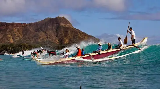 outrigger canoe riding wave