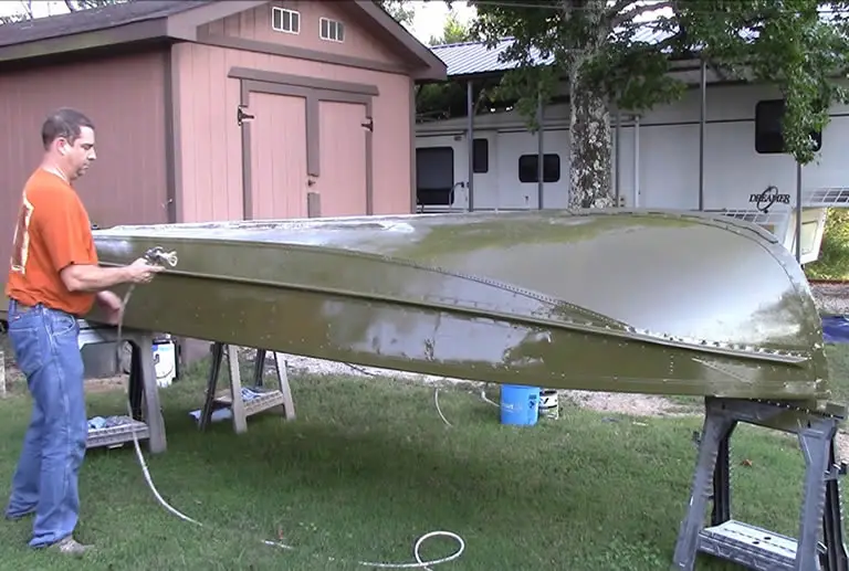 Applying paint to a Jon boat