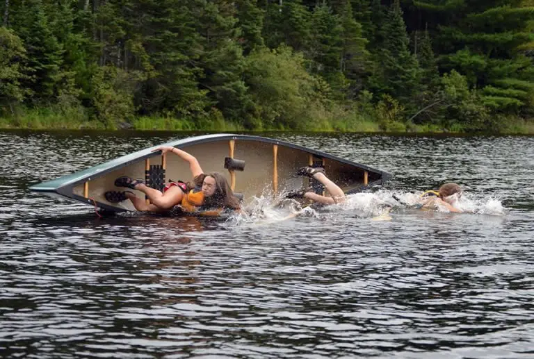 Canoe tipping over in water