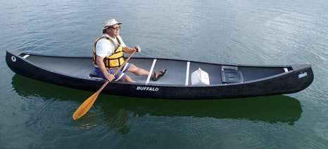 Elevated seat outfitted on canoe