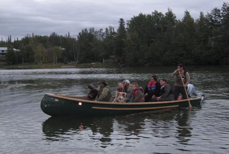 A freighter canoe filled with passengers