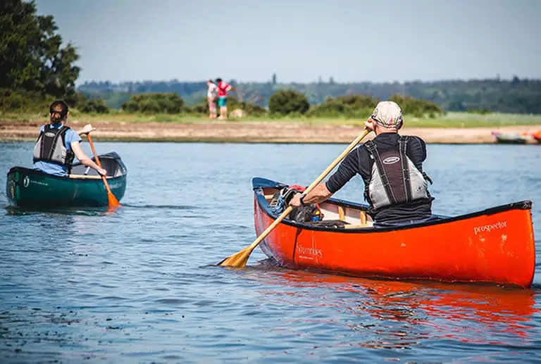 Canoeing on calm lake