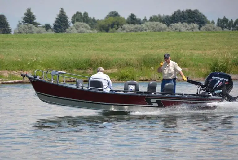 Drift boat powered by outboard motor on river