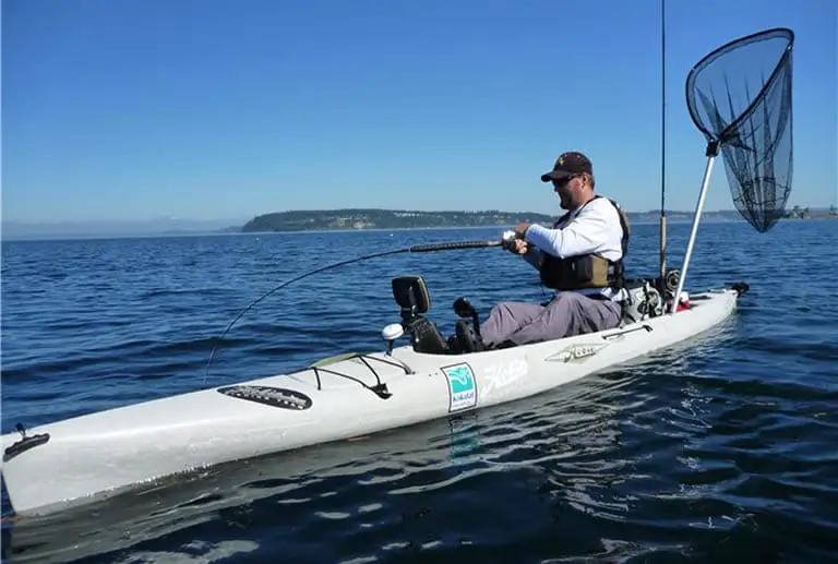 Hobie fishing kayak in large lake