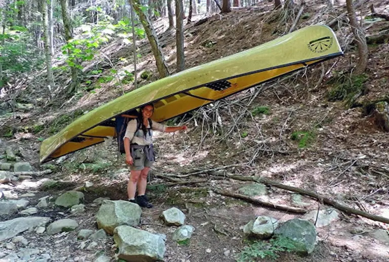 Woman canoe portaging