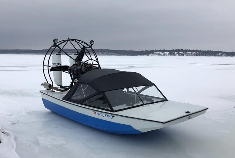 An airboat on an ice covered lake