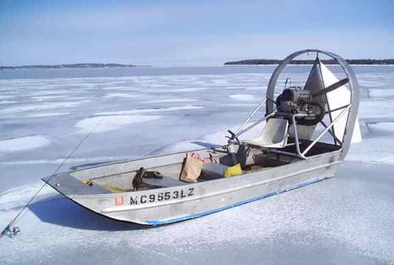 Fishing airboat on the ice