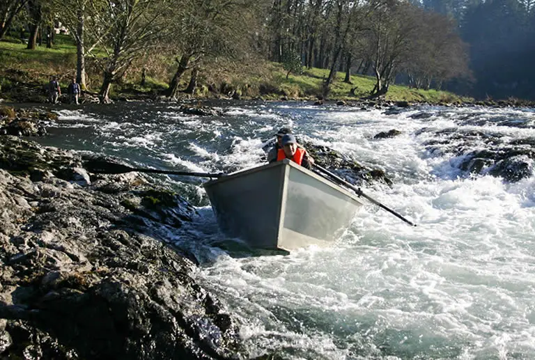 Drift boat in river rapids