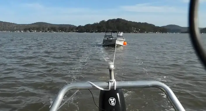 Boat towing on water