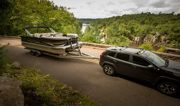 towing a boat on windy mountain path