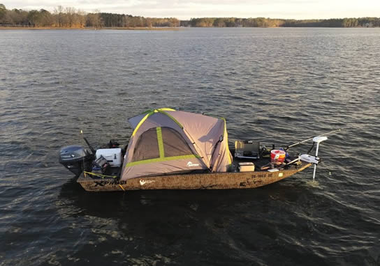 Jon boat camping on the water