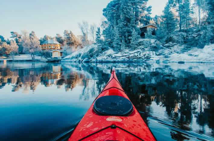 Touring kayak in winter landscape