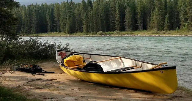 canoe on riverbank